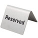 A Tablecraft stainless steel tent sign that says "Reserved" in black.
