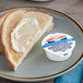 A plate of toast with Land O Lakes Fresh Buttery Taste Spread on it.
