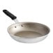 A Vollrath Wear-Ever aluminum non-stick fry pan with a black silicone handle.