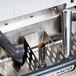 A close-up of a metal Nemco Divider for Ice Cream Dipper Wells.