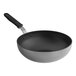 A close-up of a Vollrath SteelCoat Non-Stick Stir Fry Pan with a black and silver handle.