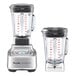 A Breville commercial blender with 2 clear Tritan containers on top of it.