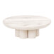 A Cal-Mil white-washed pine wood round display riser on a white round table.