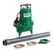An Ashland green submersible pump with a pipe.