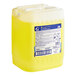 A yellow plastic container of JoySuds Joy Professional Manual Pot and Pan Detergent.
