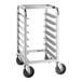 A silver metal tray cart with black wheels.