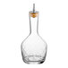 A Barfly clear glass bitters bottle with a cork stopper.