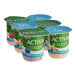 A row of Dannon Activia yogurt cups with strawberry, blueberry, and peach labels.