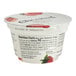 A Chobani Non-Fat Strawberry Greek Yogurt container on a white background. The container has strawberries on top.