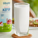 A close-up of a glass of Lifeway Original Plain Kefir next to a glass of milk.