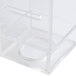 A clear plastic box with a handle and a lid containing clear plastic infusion chamber parts.