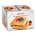 A box of Krusteaz Belgian waffles with berries on top.