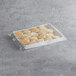 A Bakery Chef box of baked buttermilk biscuits in plastic wrap.