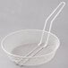 A white wire mesh basket with a handle.