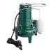 A green and white Zoeller M267 automatic sewage pump with a hose attached.