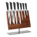A Mercer Culinary Damascus knife set on a wooden stand.
