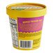 A yellow container of Eclipse Foods Vegan Mango Passion Fruit Ice Cream with a label.