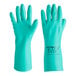 A pair of green Ansell AlphaTec Solvex nitrile gloves with cotton flock lining.