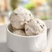A bowl of Eclipse Foods mint chip ice cream with a scoop of ice cream and chocolate chips.