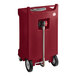 A burgundy HDPE rectangular PourAway liquids disposal receptacle with wheels and a hose.