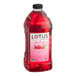 A close up of a large bottle of pink Lotus Plant Energy Concentrate.