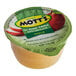 A close-up of a Mott's No Sugar Added Applesauce cup on a table.