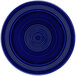 A cobalt blue Tuxton Concentrix china plate with white spiral designs.