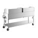 A white metal cart with wheels holding a stainless steel Backyard Pro outdoor grill.