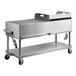 A large stainless steel Backyard Pro outdoor grill on wheels.