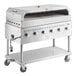 A stainless steel Backyard Pro outdoor grill with four burners on wheels.