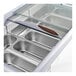 An Avantco gelato dipping cabinet with a curved glass top and silver trays inside.