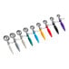 A set of six Choice ergonomic thumb press ice cream scoops in different colors.
