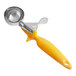 A yellow plastic and silver metal Choice 20 yellow ergonomic thumb press food scoop.