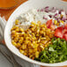 A bowl of Simplot RoastWorks flame-roasted corn with other vegetables.