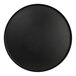 A black round melamine platter with a raised rim.