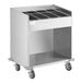A silver stainless steel ServIt tray cart with a shelf.