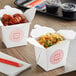 Two Emperor's Select microwavable paper take-out containers filled with food on a table.