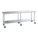 A Steelton stainless steel work table with undershelf and casters.