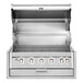 A stainless steel Crown Verity built-in grill with four burners, knobs, and lights.
