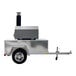 A silver Chicago Brick Oven Tailgater with a metal hood on a small trailer.