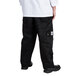 A person wearing Chef Revival black cargo pants.