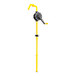 A yellow and black Vestil manual rotary drum pump with a yellow pipe and hand valve.