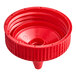 A red plastic Vollrath Traex bottle cap with a circle in the middle.