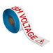 A roll of Superior Mark white safety tape with red "Danger High Voltage" text.