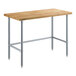 A Regency wood top work table with galvanized metal legs.