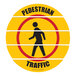 A yellow Superior Mark floor sign with a black silhouette of a person walking in a circle and black and red text.