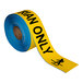 A roll of yellow tape with black "Pedestrian Only" text.