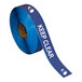 A roll of blue and white Superior Mark safety tape with the words "Keep Clear" on it.
