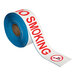 A roll of white and red Superior Mark "No Smoking" safety tape.