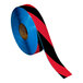 A roll of black and blue safety tape with a red stripe.